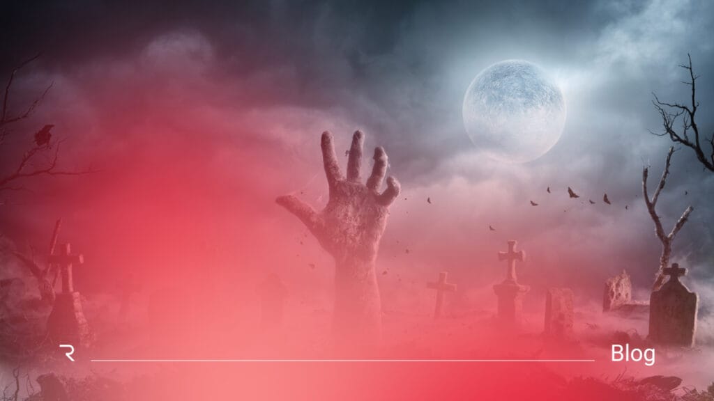Zombie permissions concept illustrated with undead hand in graveyard under full moon, symbolizing identity security risks and disconnected access systems